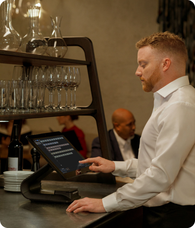 Waiter using the SpotOn within a Fine dining restaurant
