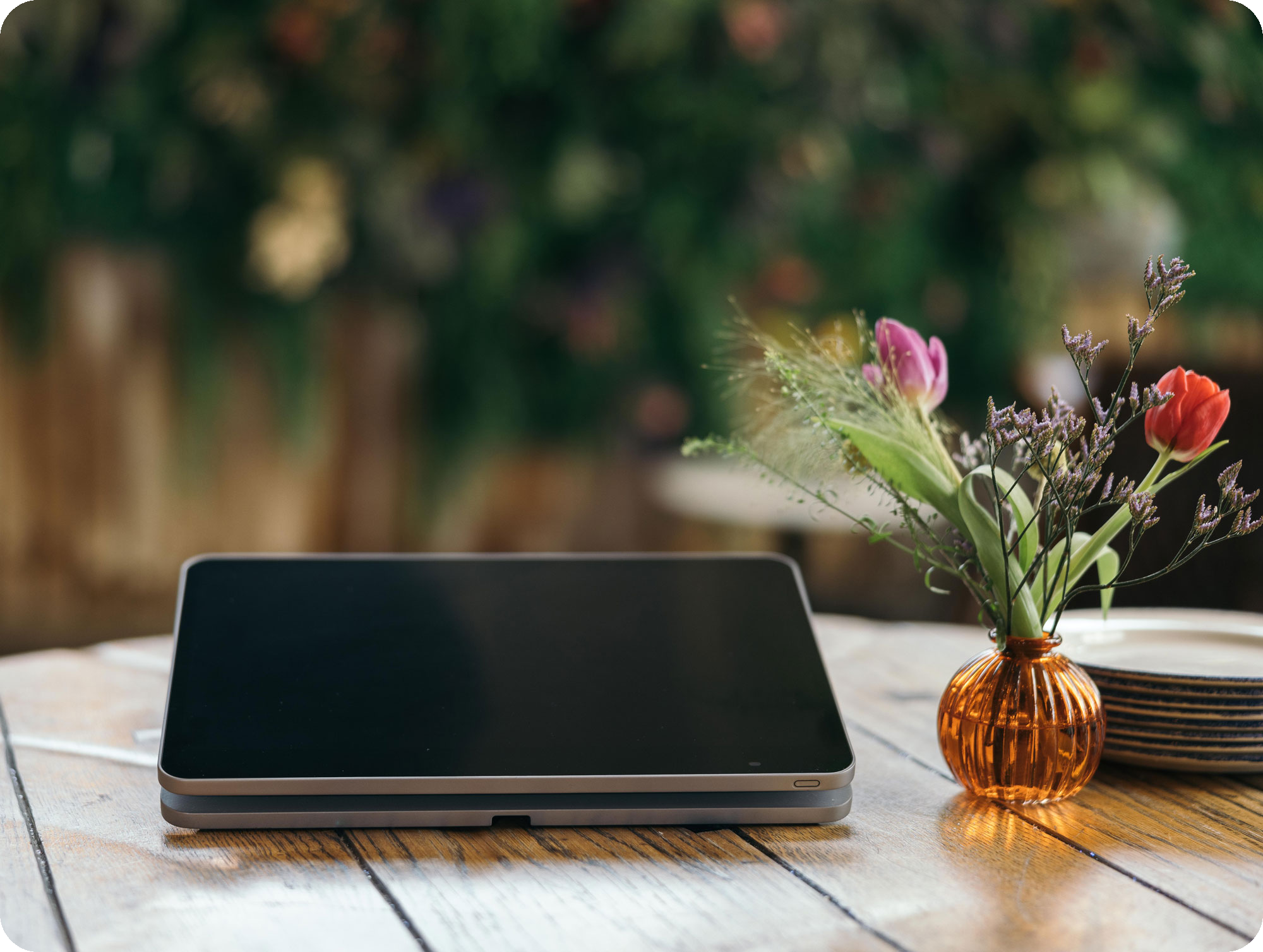 Oracle Simphony hardware on a dining table outside